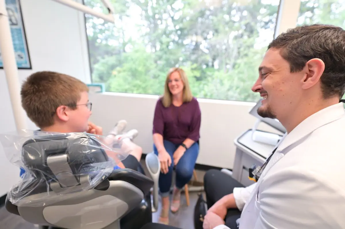 Dr. Cameron Freelove explains about orthodontic appliances treatment to his patients in Sammamish, WA