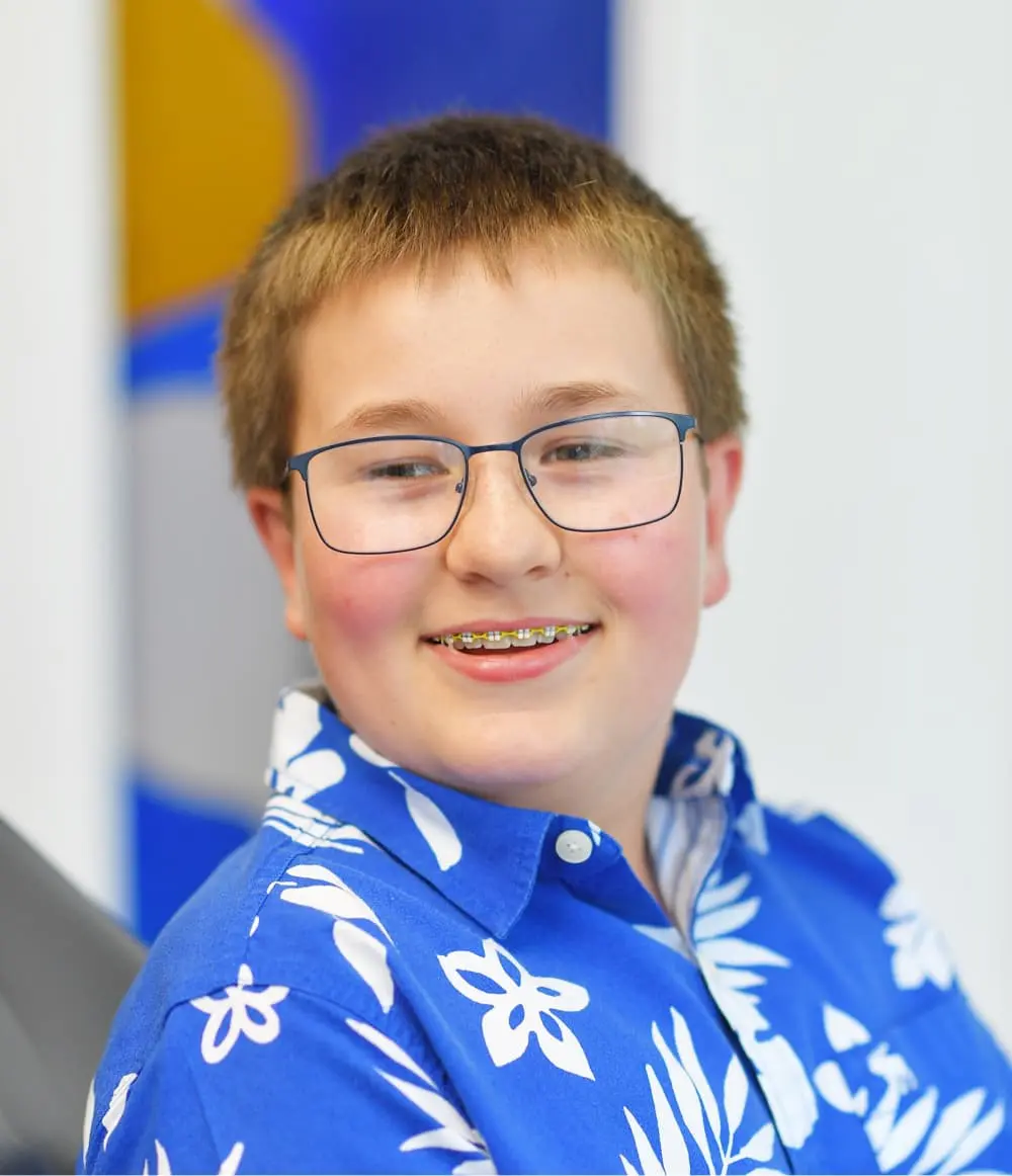 A portrait of a boy with metal braces, after a Personalized Top-Rated Sammamish, WA Orthodontic Treatment