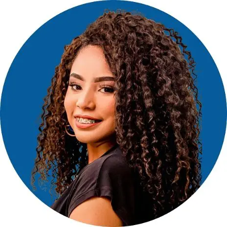 Young woman with curly hair and braces, smiling against a blue circular background. Illustrating adult braces in Sammamish and Kent, WA