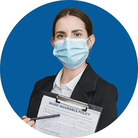 Person wearing a face mask holds a clipboard with Invisalign insurance policy form in Sammamish or Kent, WA.